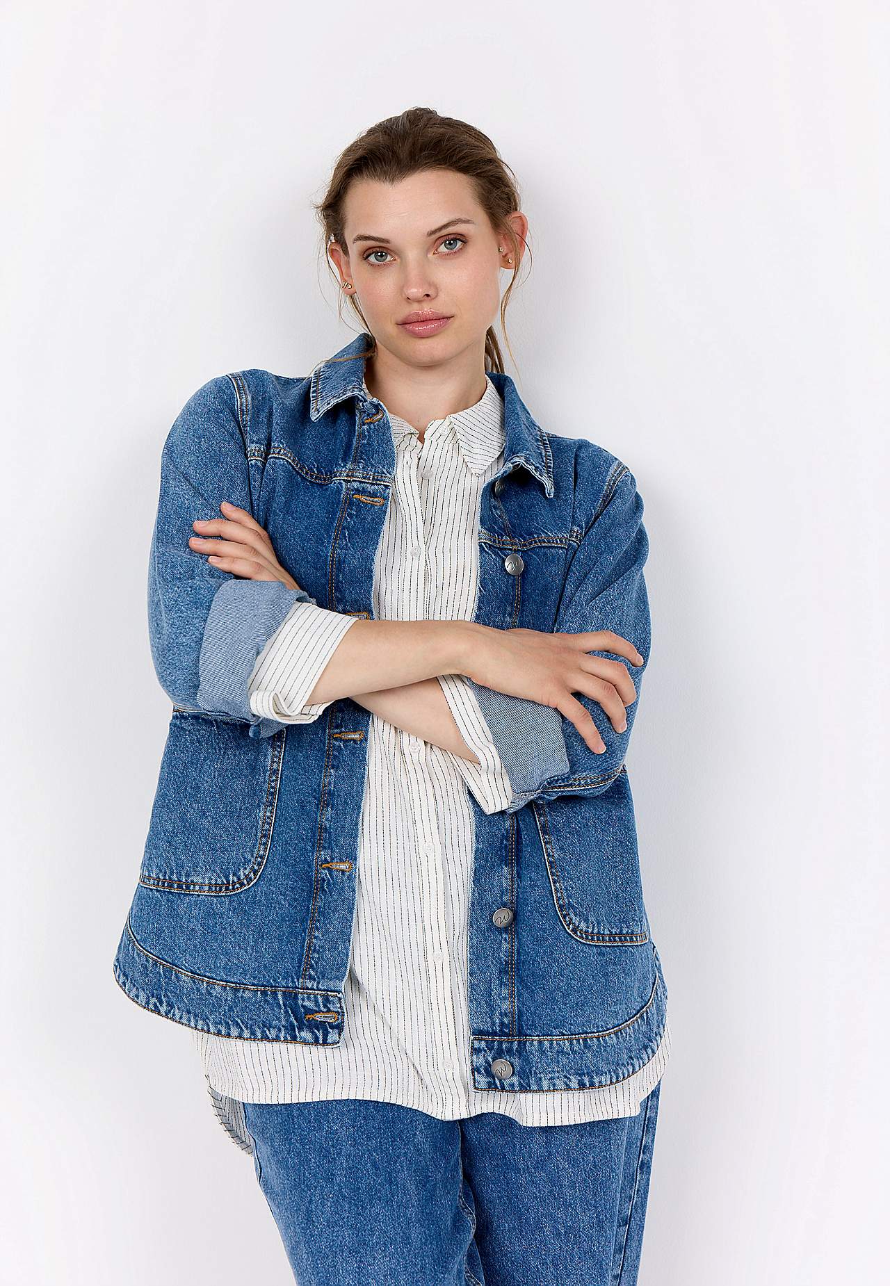 Pikk teksajakk suurte esitaskutega